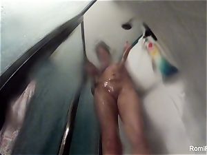 pornstar Romi Rain brings her camera in the shower